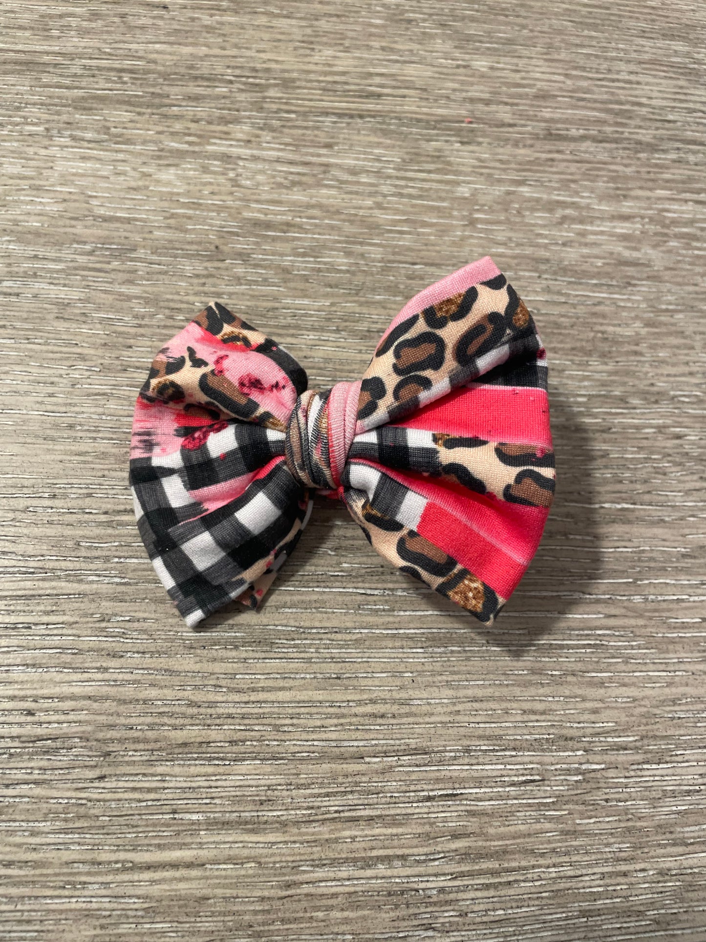 Pink brushstrokes leopard clip bow