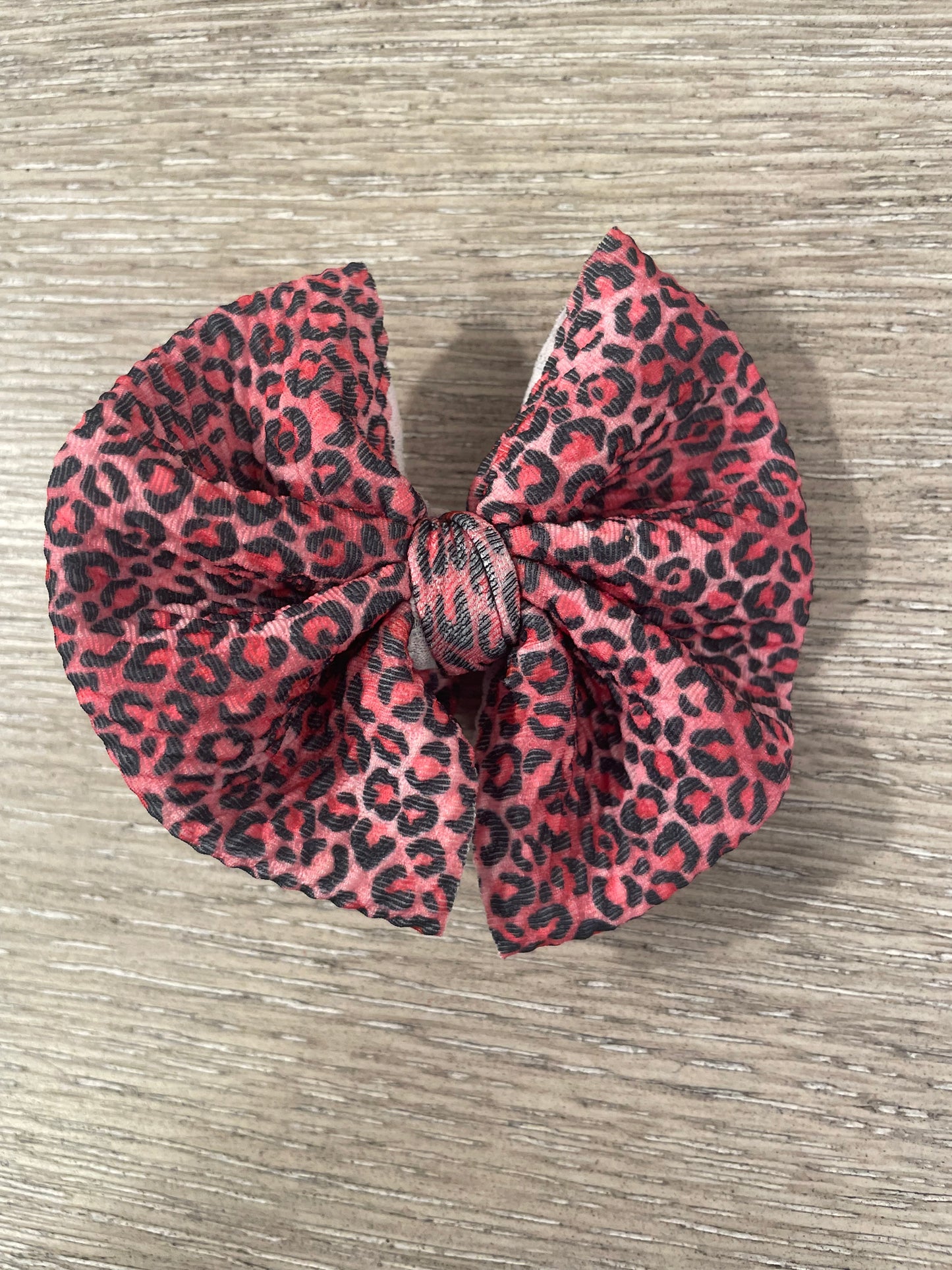 Pink leopard clip bow