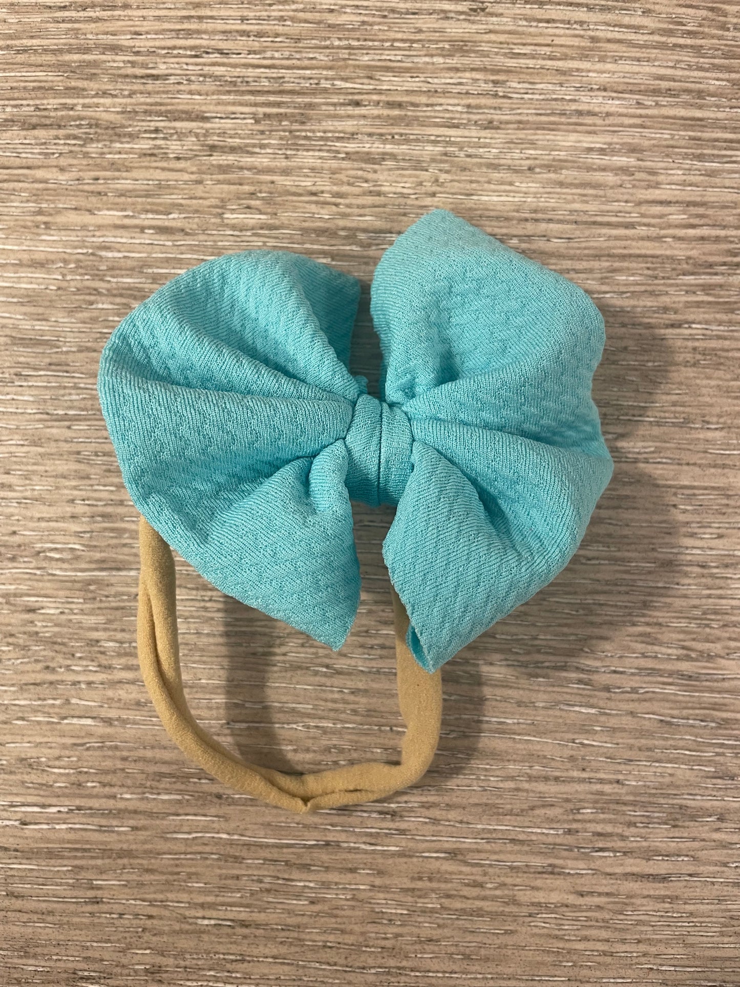 Tiny aqua nylon bow