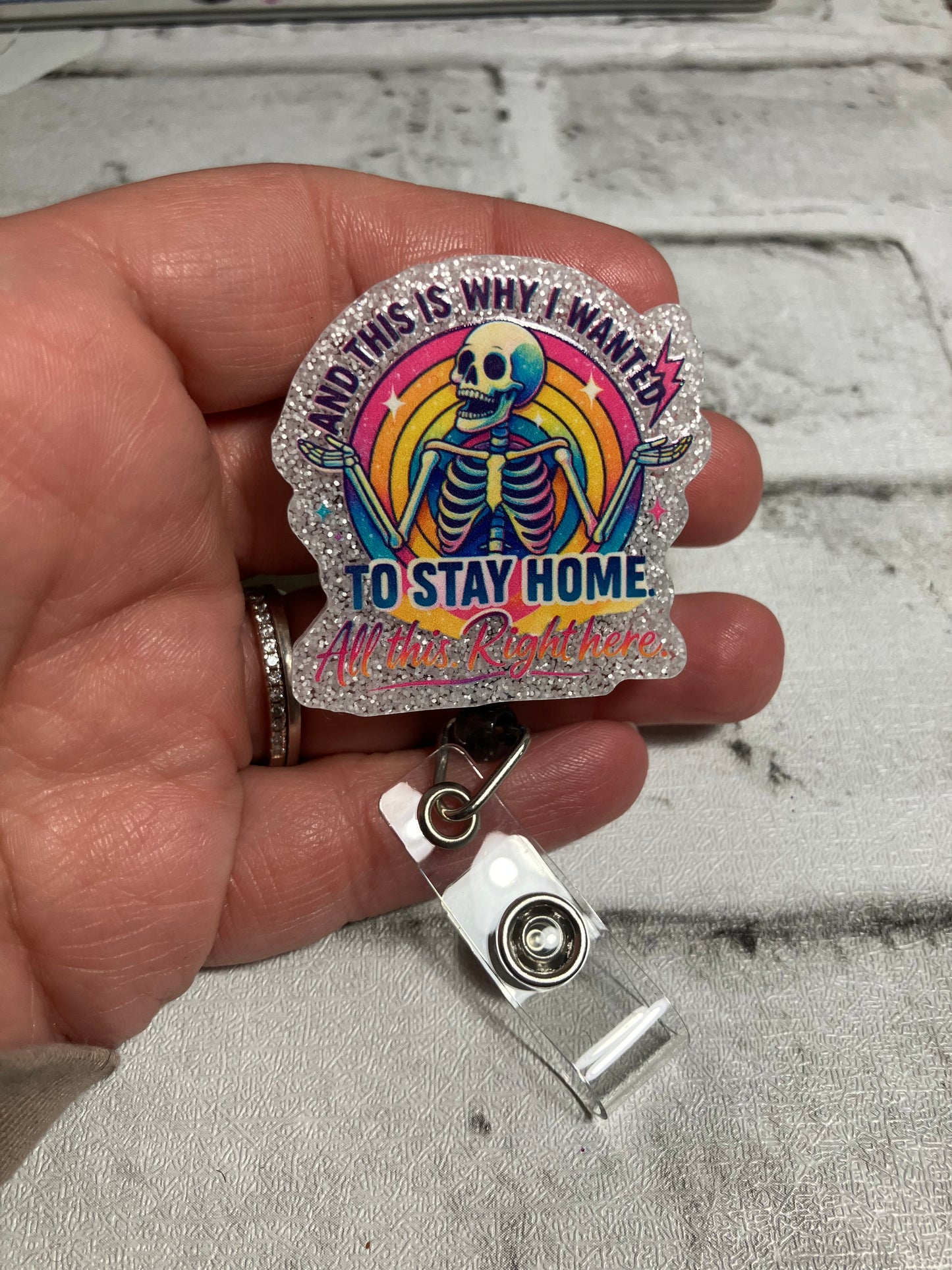 And this is why I wanted to stay home all this right here badge reel