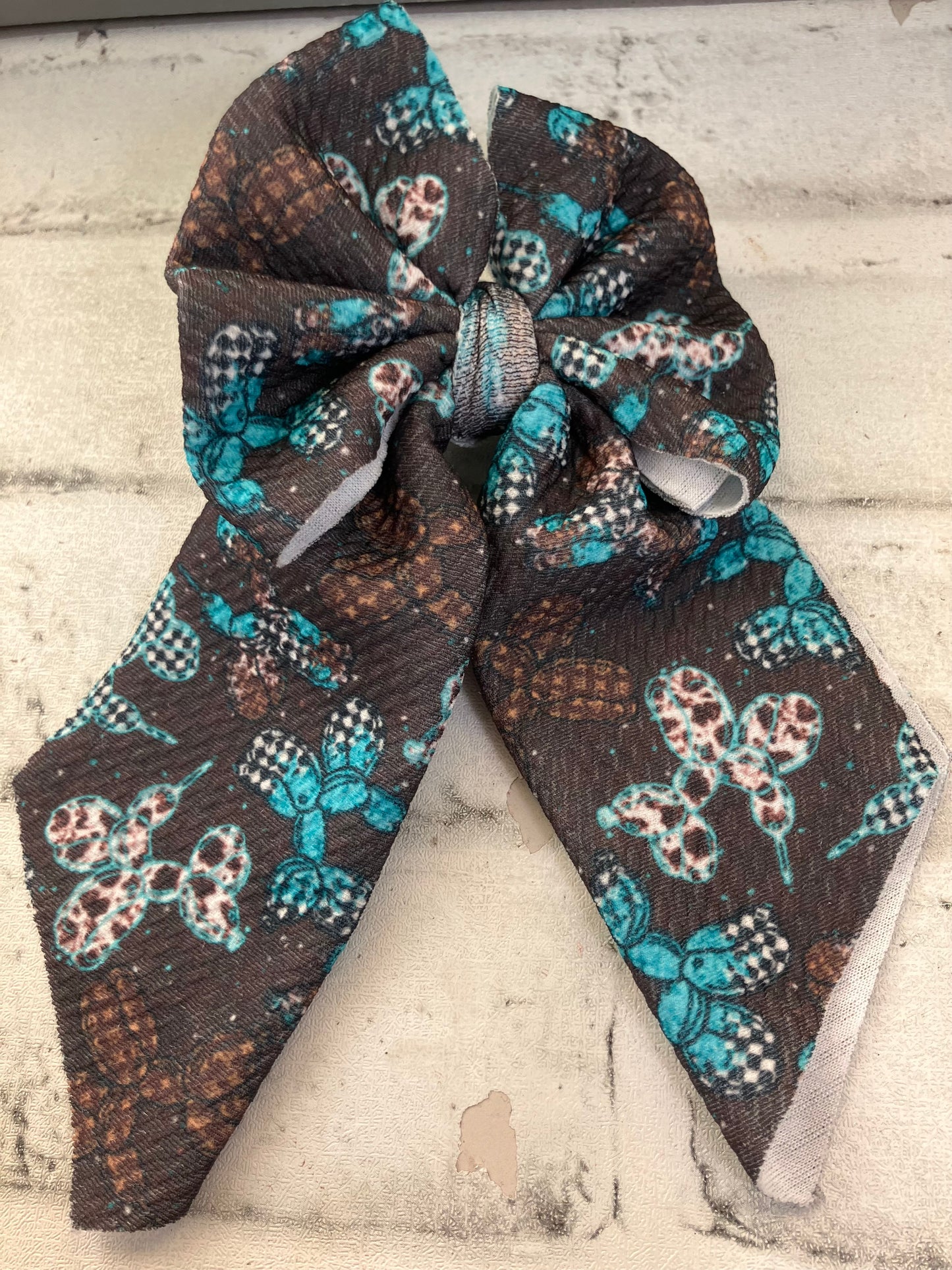 Checkered turquoise balloon animals sailor bows