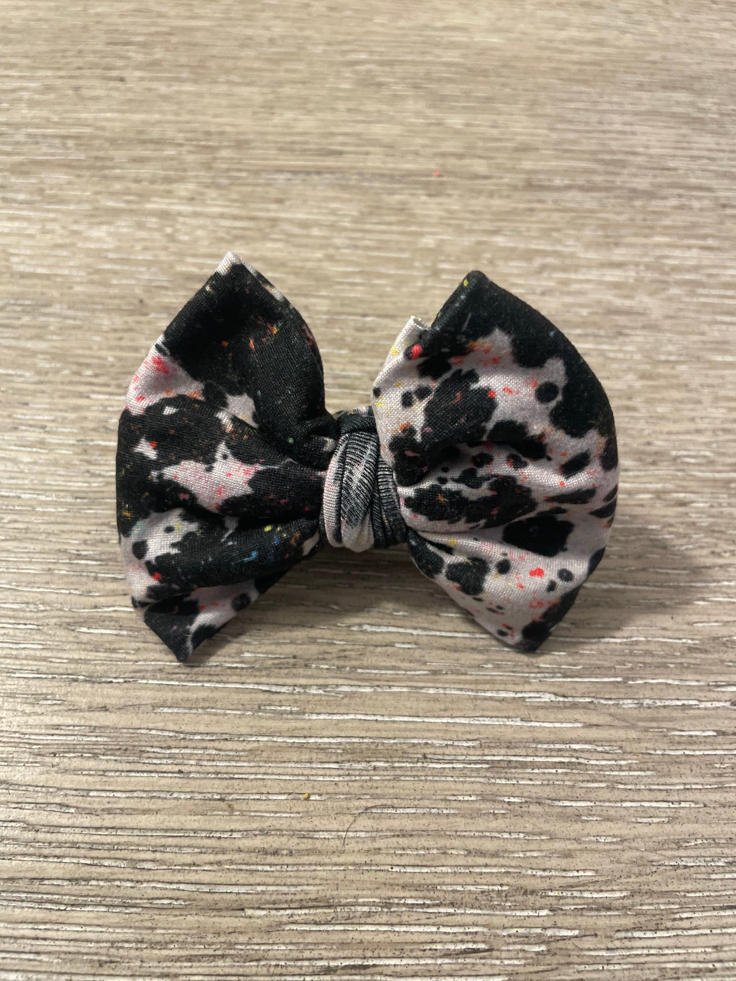 Cow paint splatter clip bow