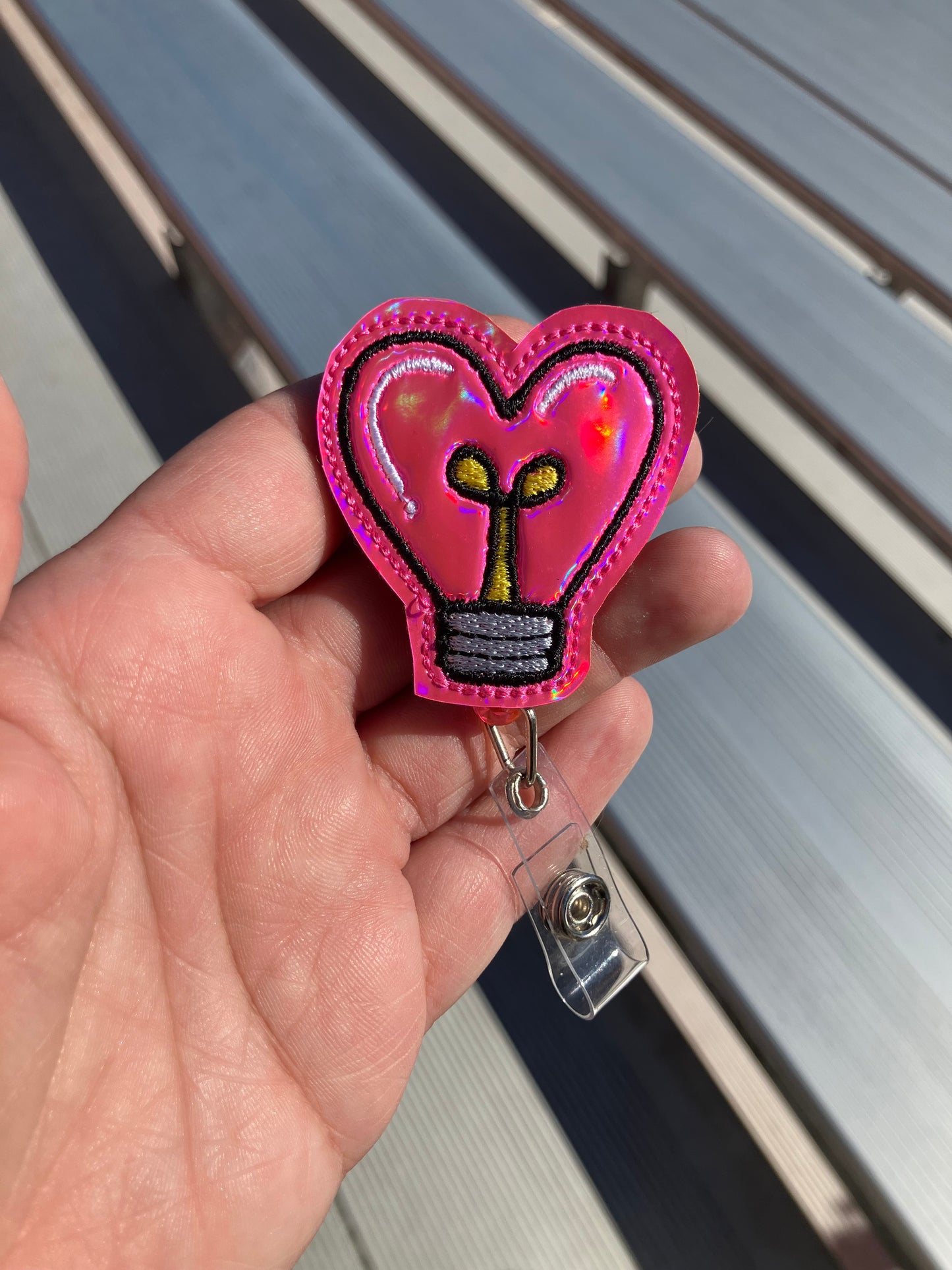 Light bulb badge reel