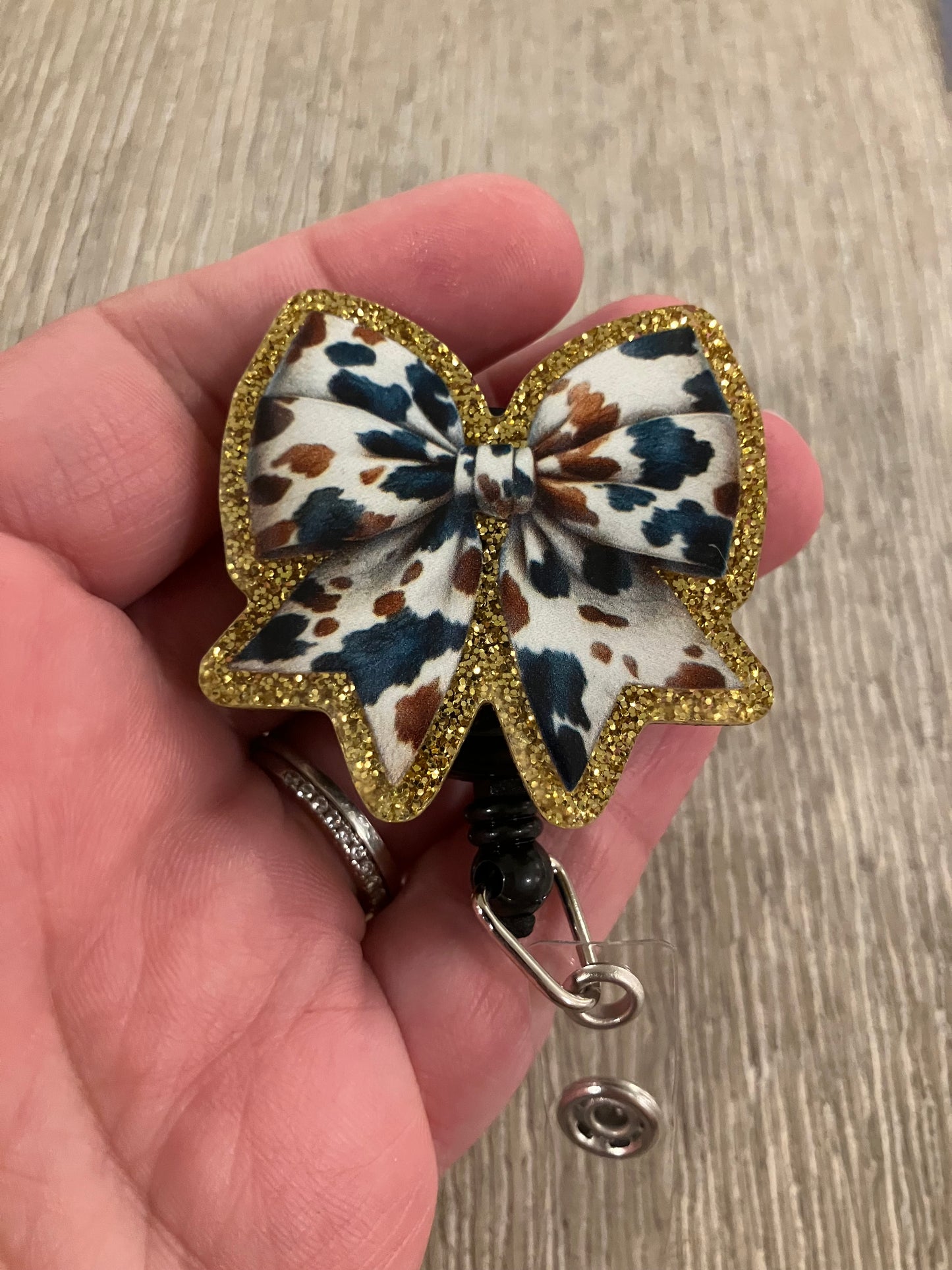 Cow bow badge reel