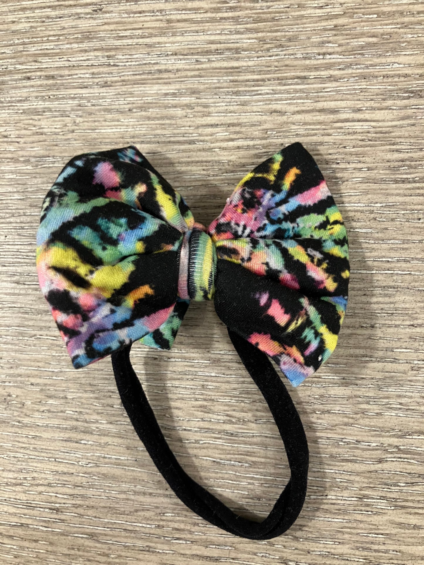 Reverse tie dye nylon bow