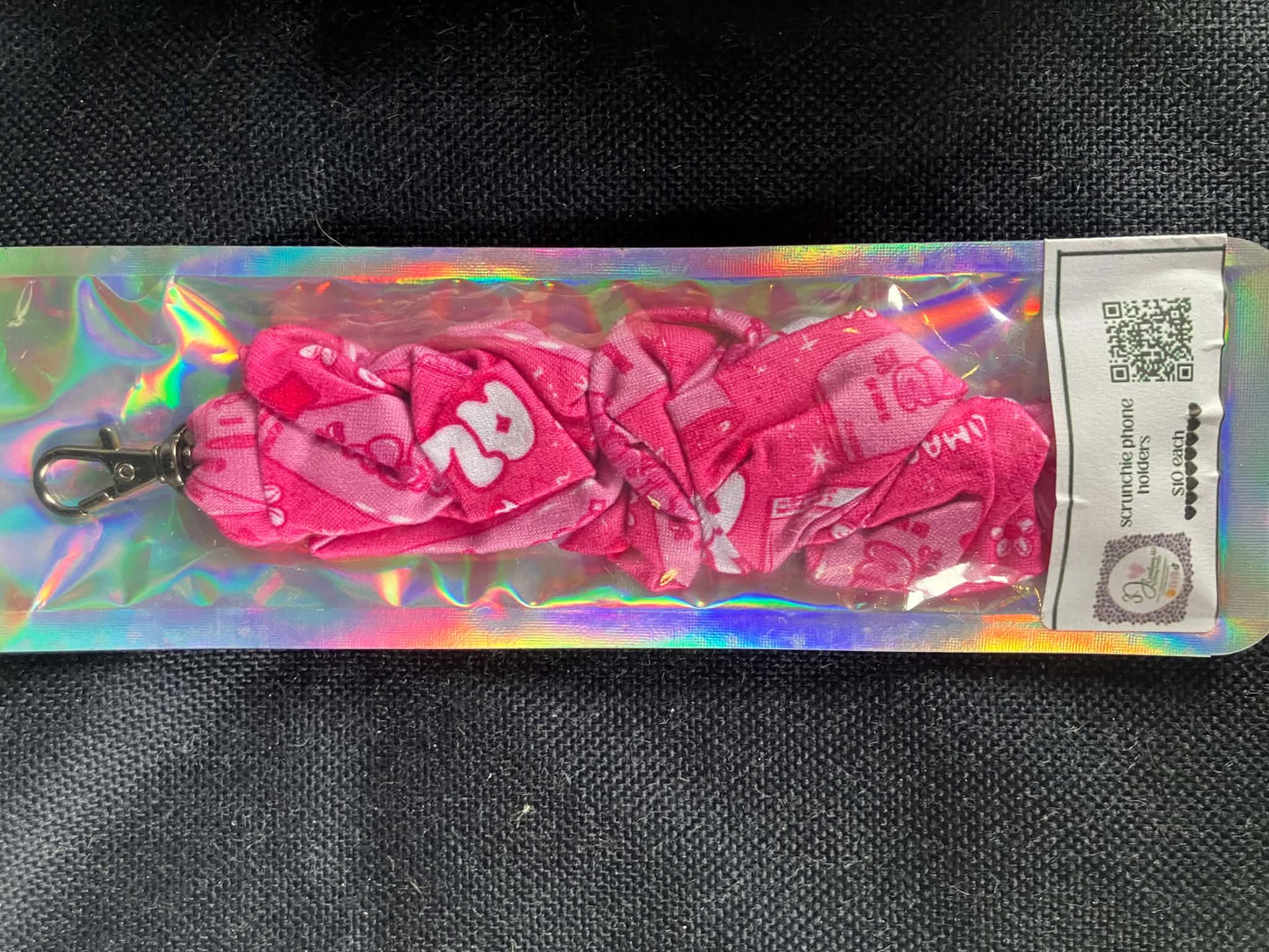 Pink energy drink scrunchie phone holder