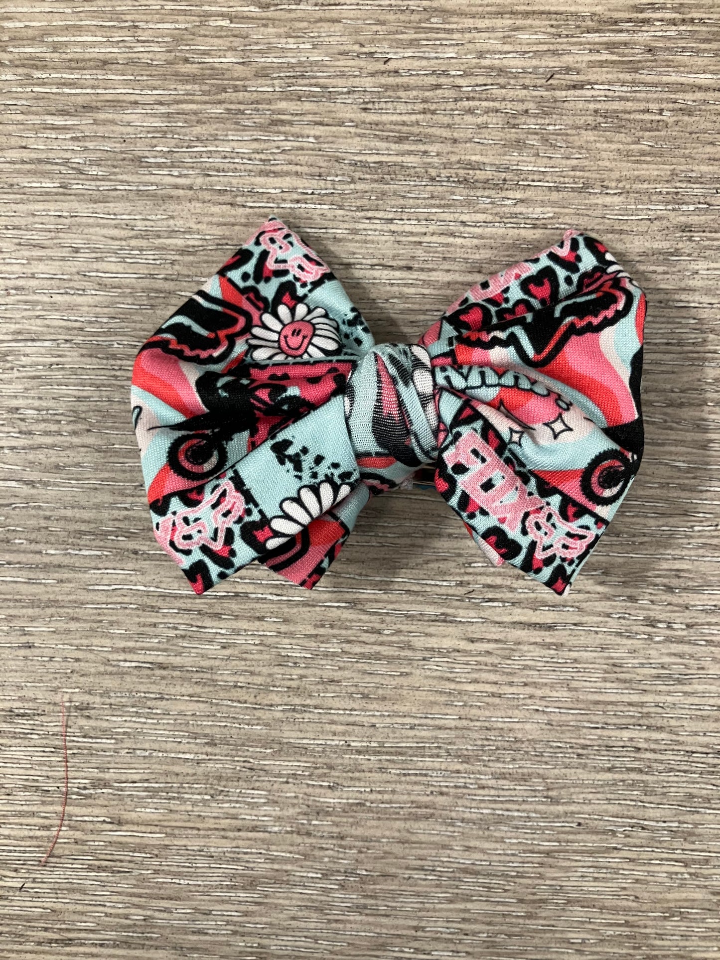 Teal pink racing clip bow