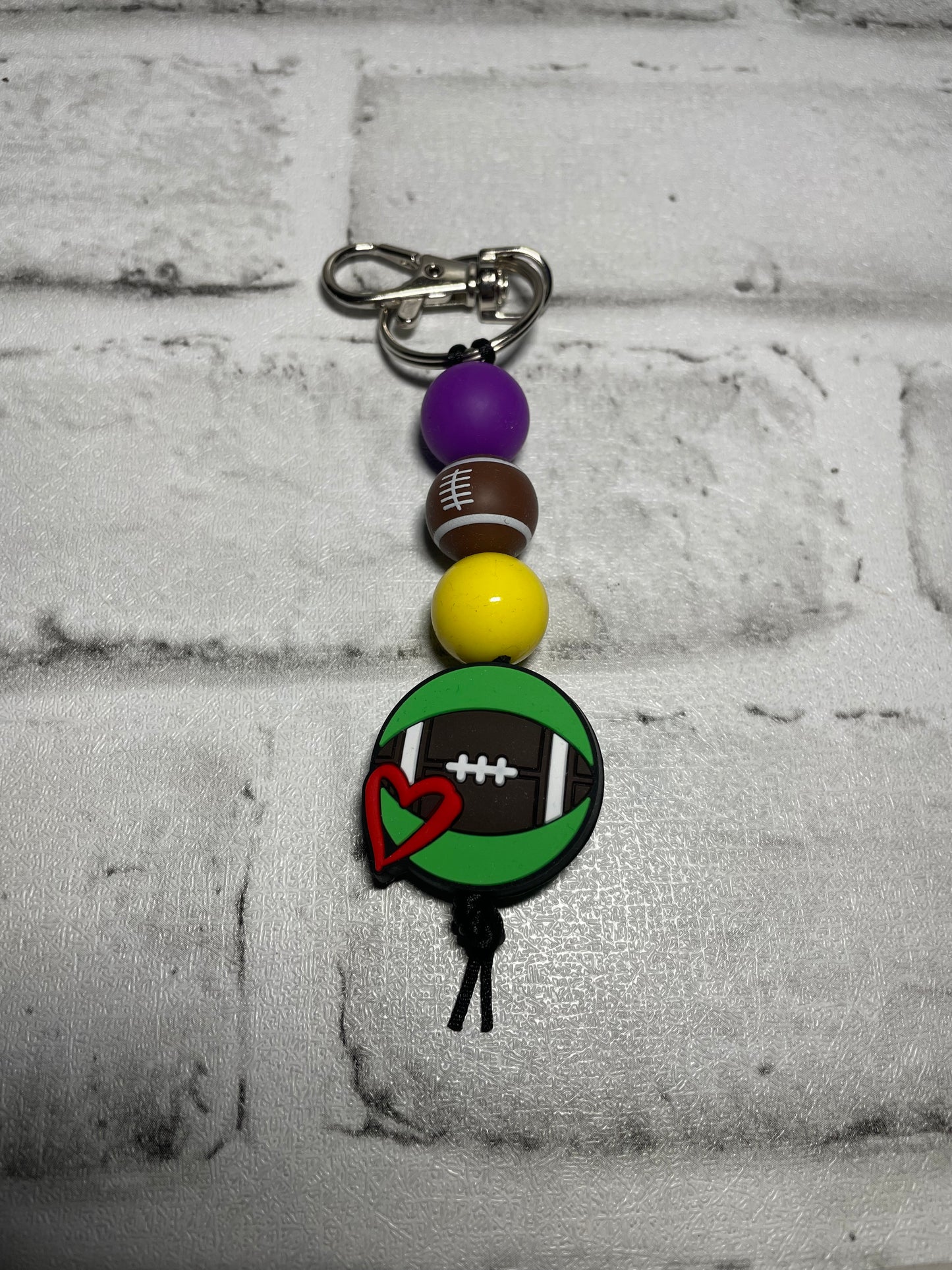 Football heart purple/yellow keychain🩵