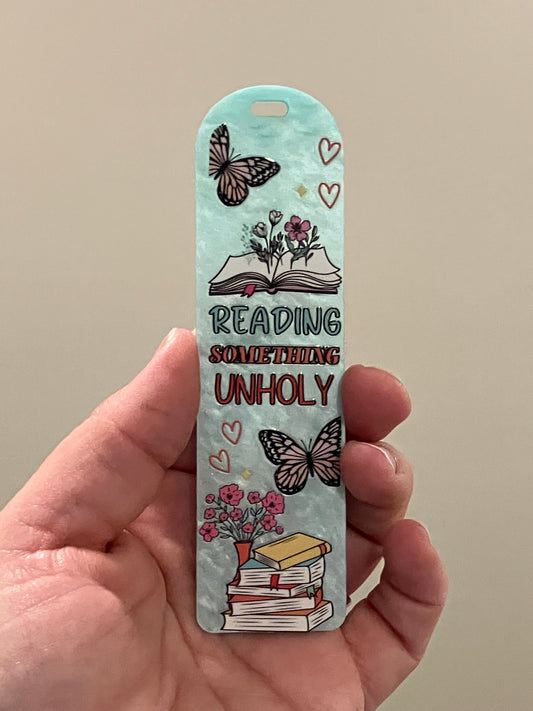 Reading something unholy blue bookmark