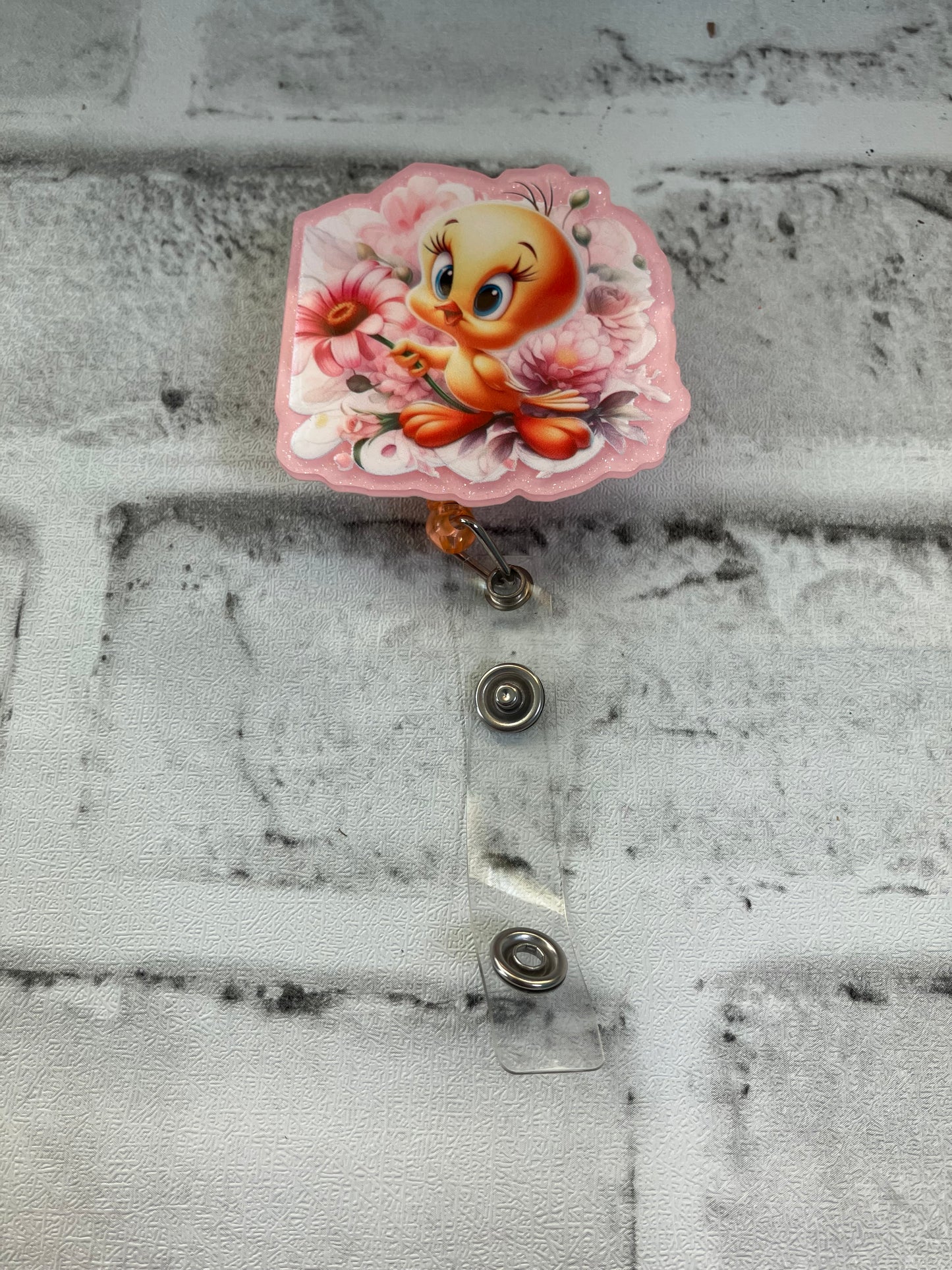 Yellow bird badge reel