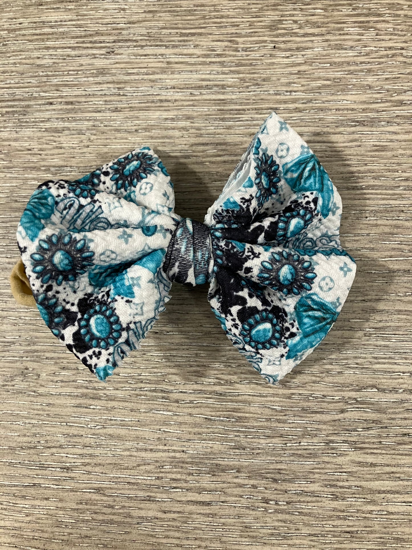 Turquoise cow nylon bows
