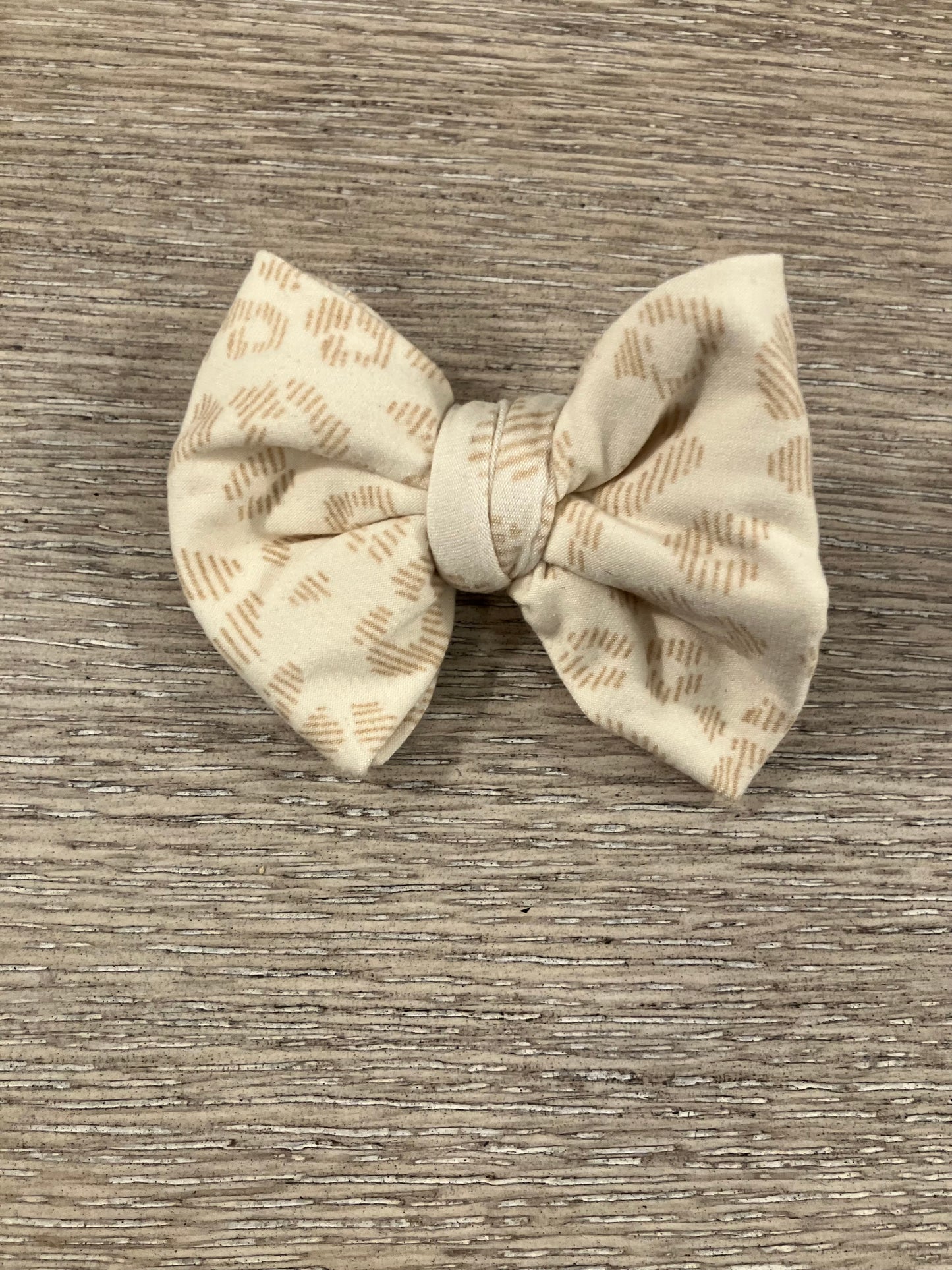 Beige leopard clip bows