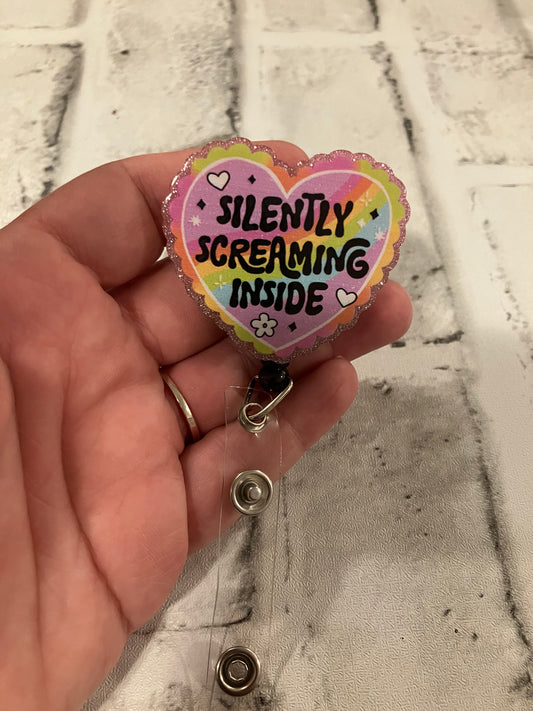 Silently screaming inside badge reels