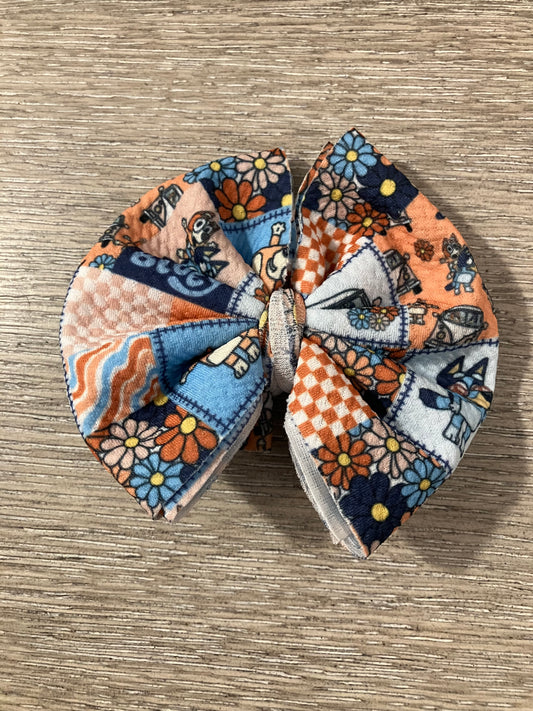 Blue and orange dog clip bows