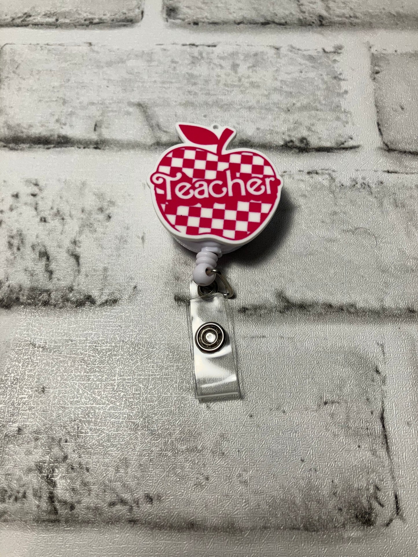 Teacher badge reel