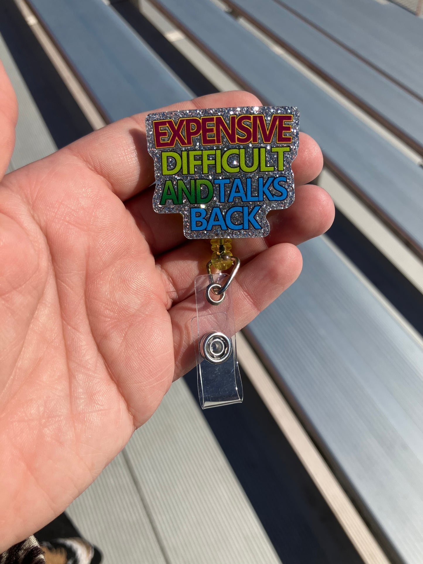 Expensive difficult and talks back badge reel