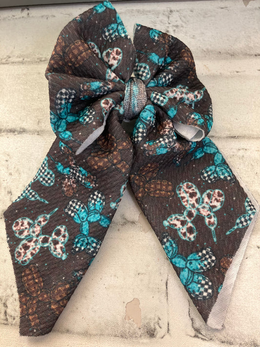 Checkered turquoise balloon animals sailor bows