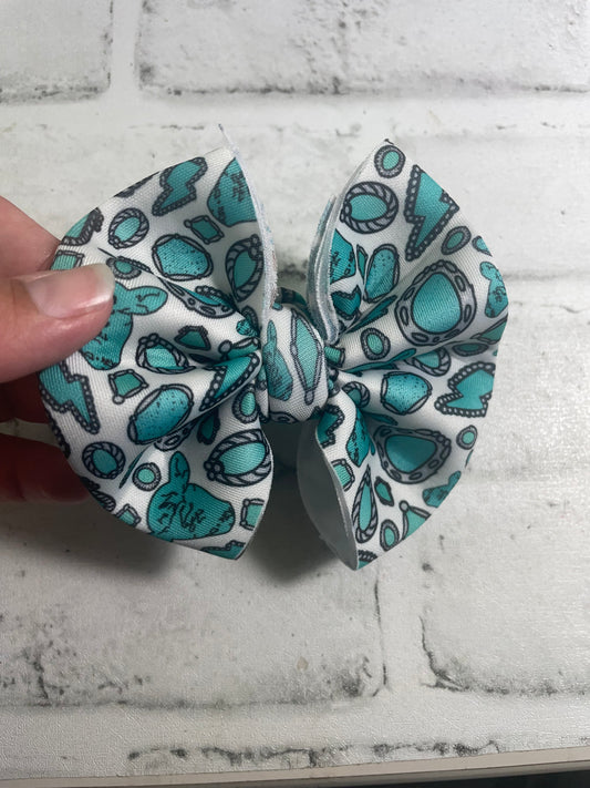 Turquoise cow clip bow