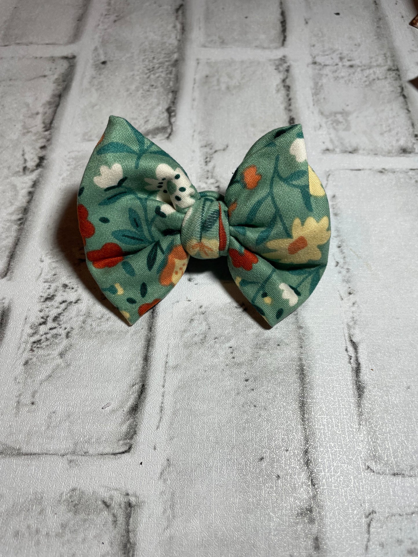 Green floral clip bow