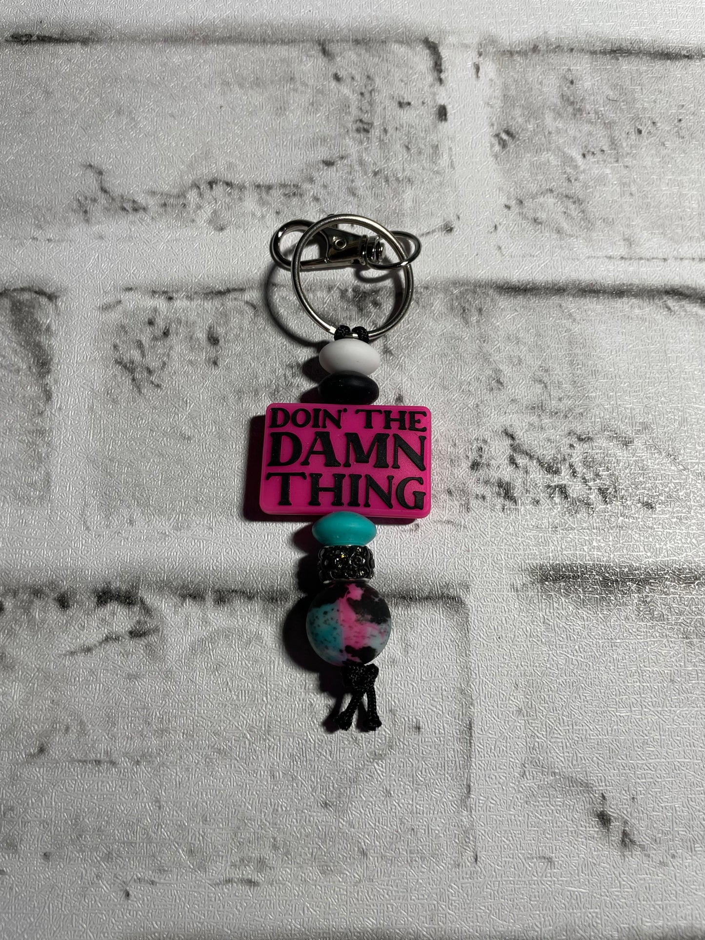 Doin’ the damn thing keychain🩵