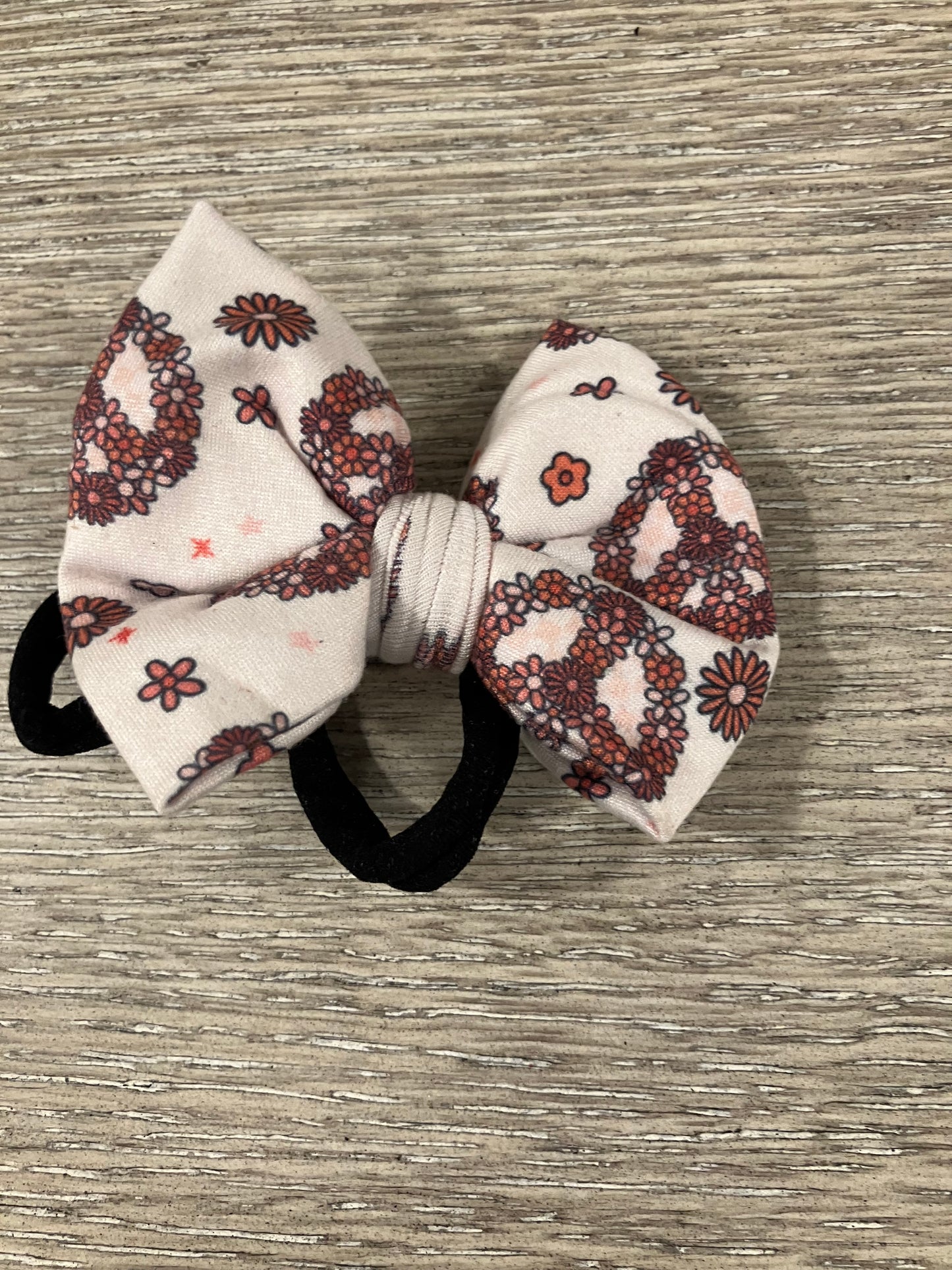 Floral peace sign nylon bow