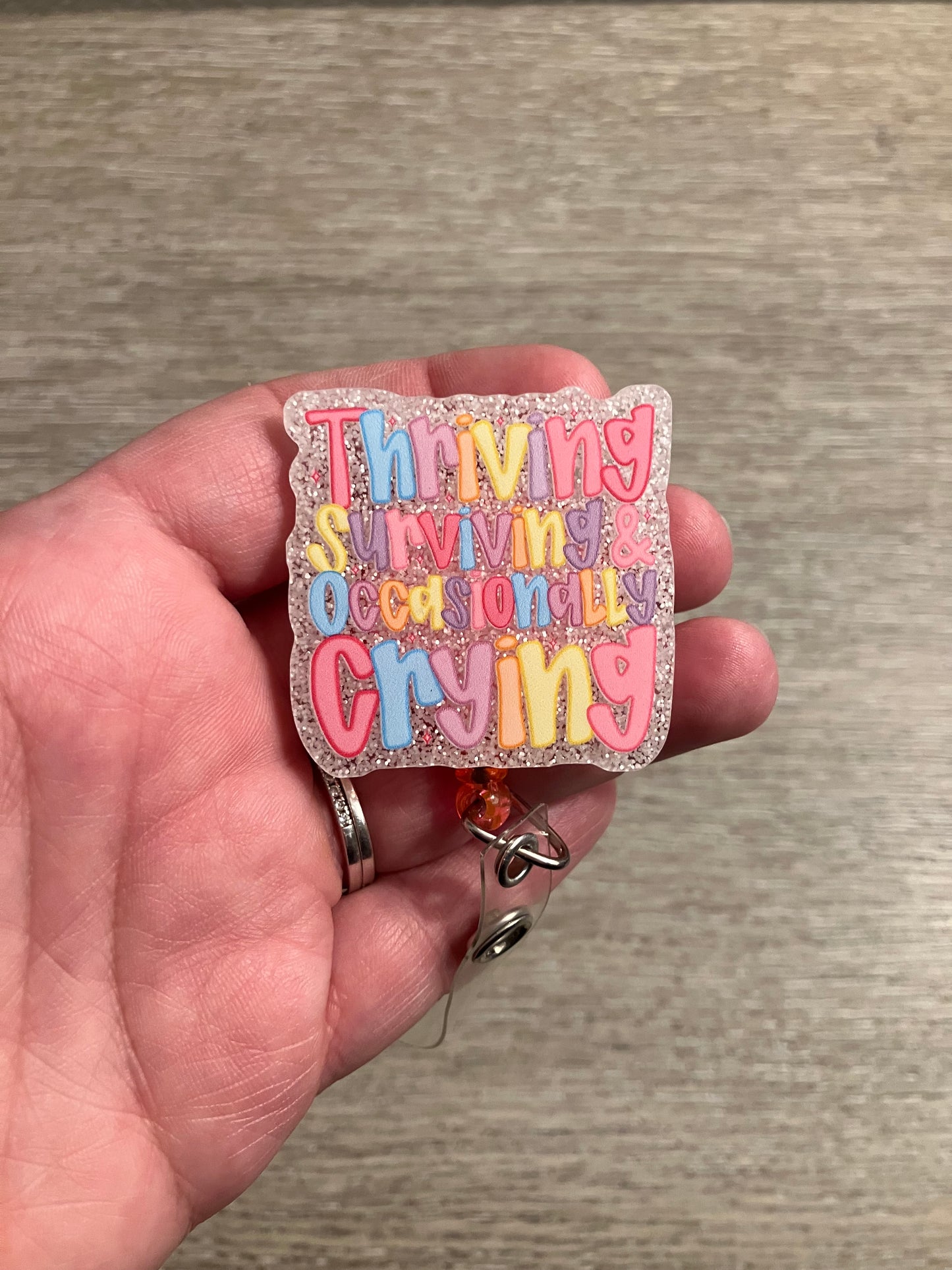 Thriving surviving and occasionally surviving badge reels