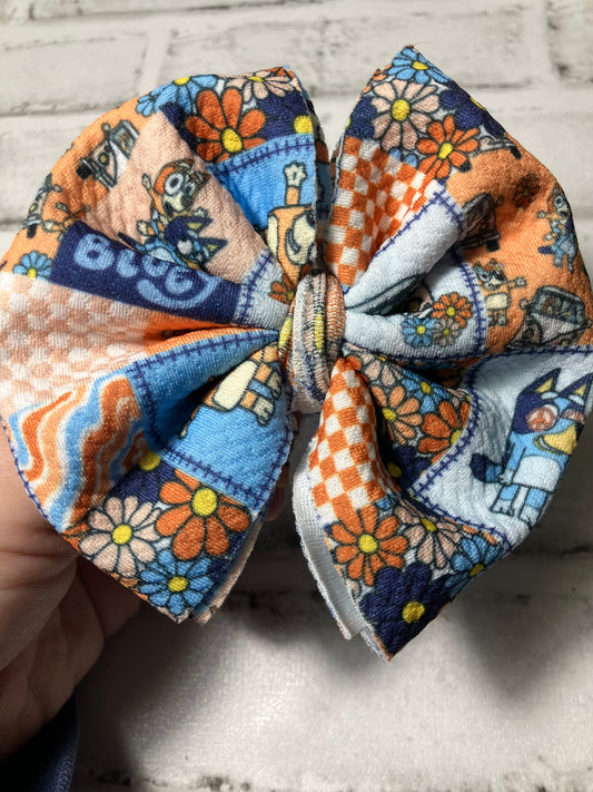 Blue and orange dog clip bow