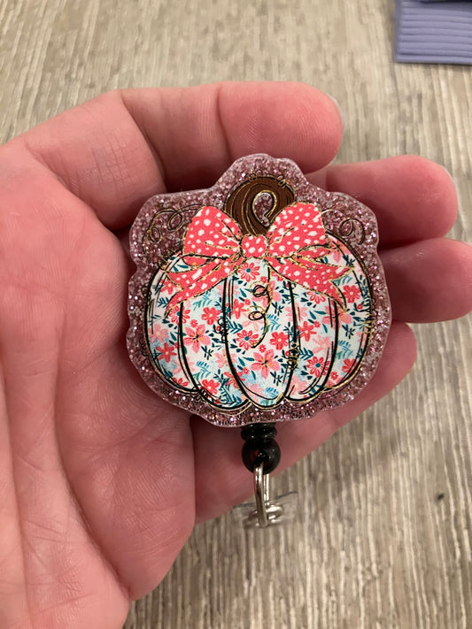 Pink pumpkin badge reel