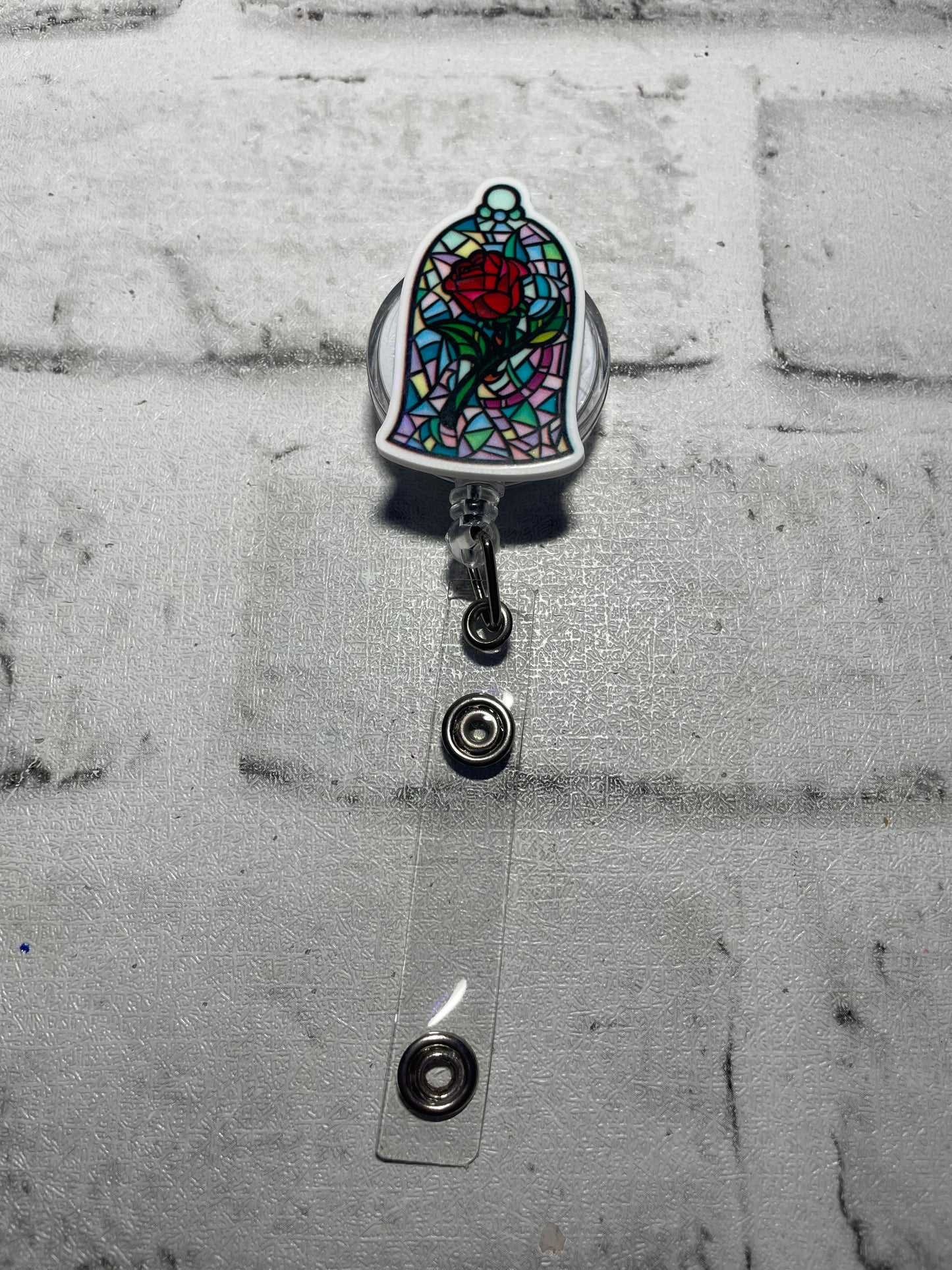 Stained glass rose badge reel