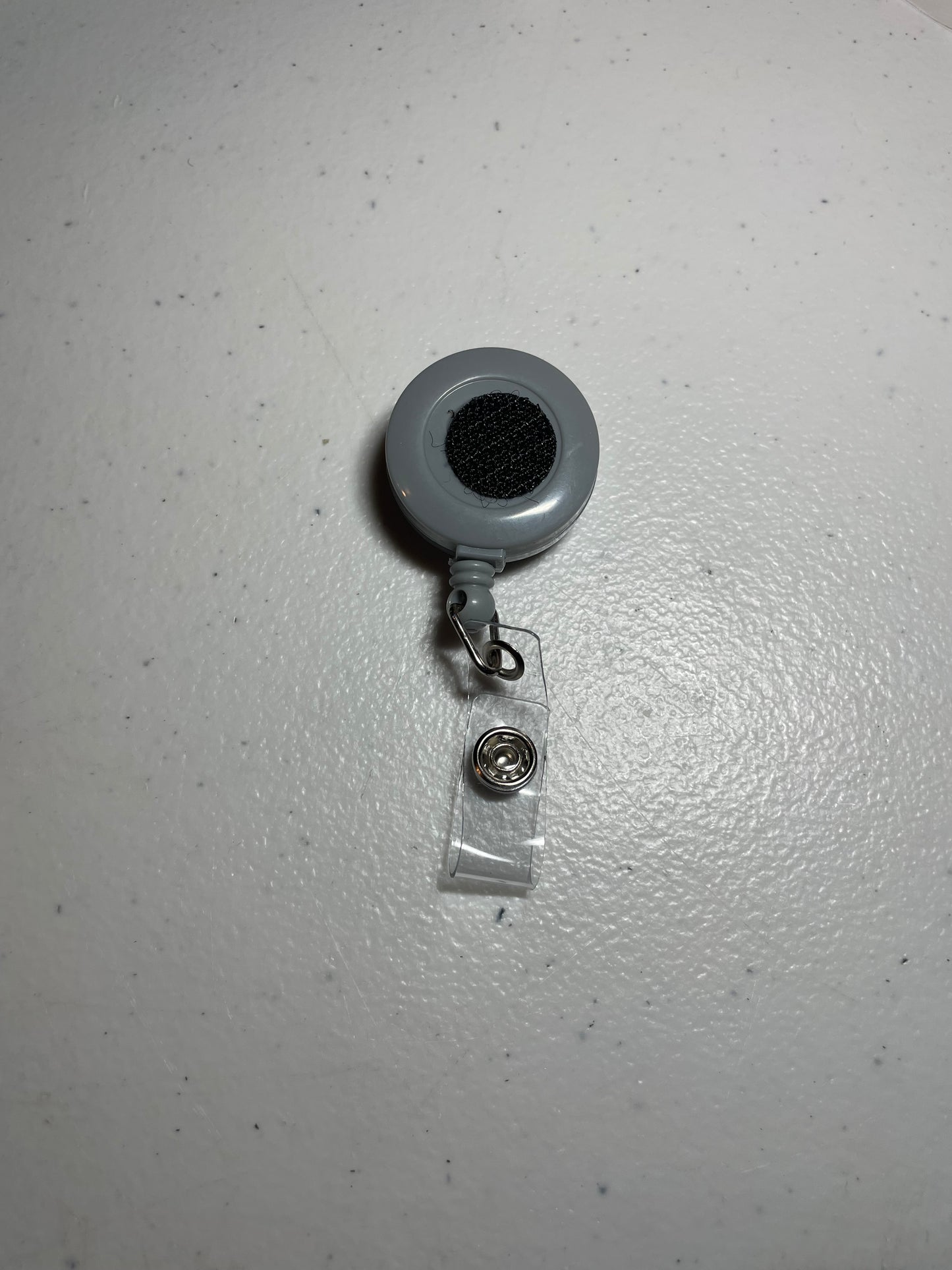 Gray badge reel base