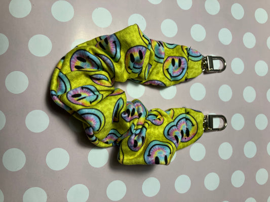 Yellow smiley scrunchie phone holders