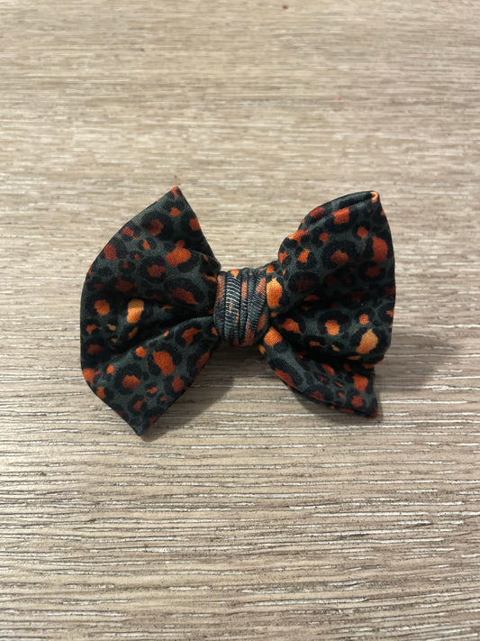 Deep teal gold leopard clip bow