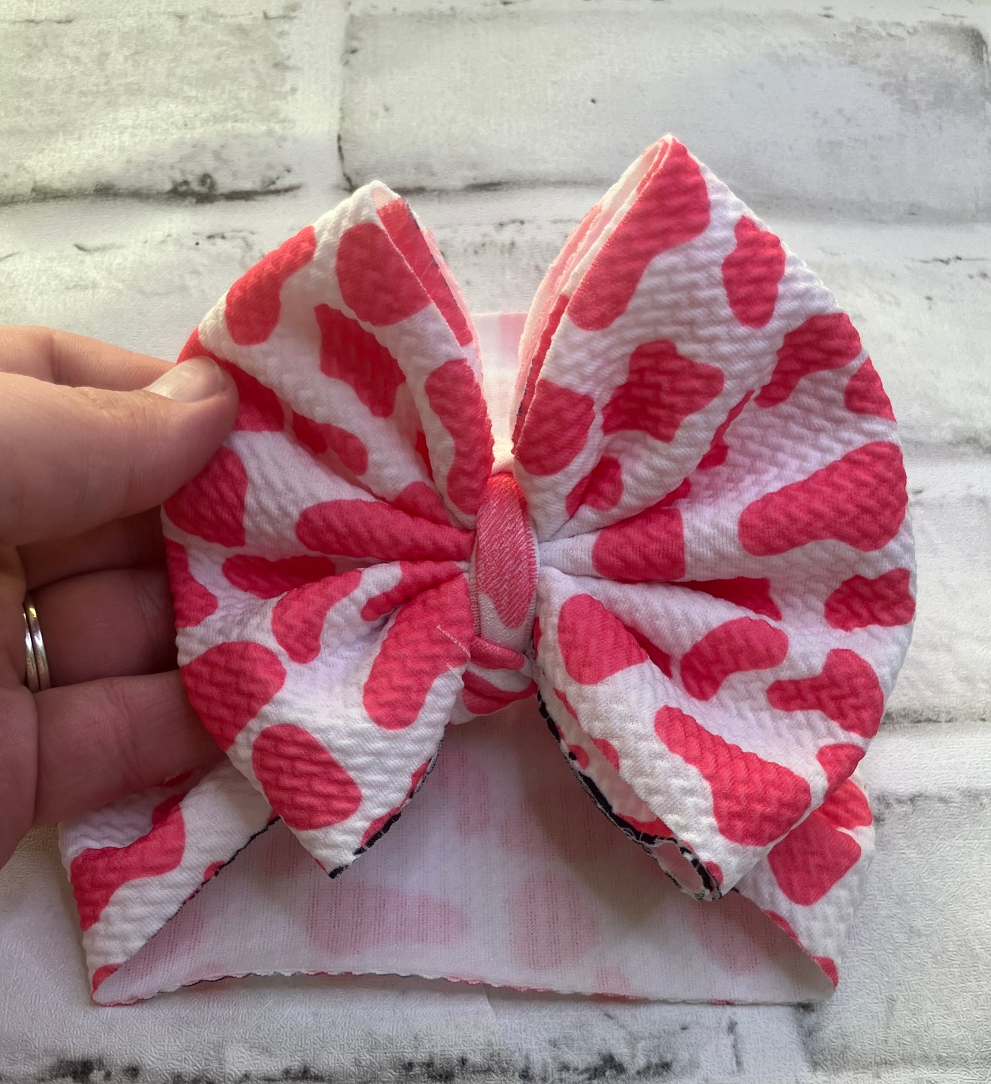 Pink cow newborn bow