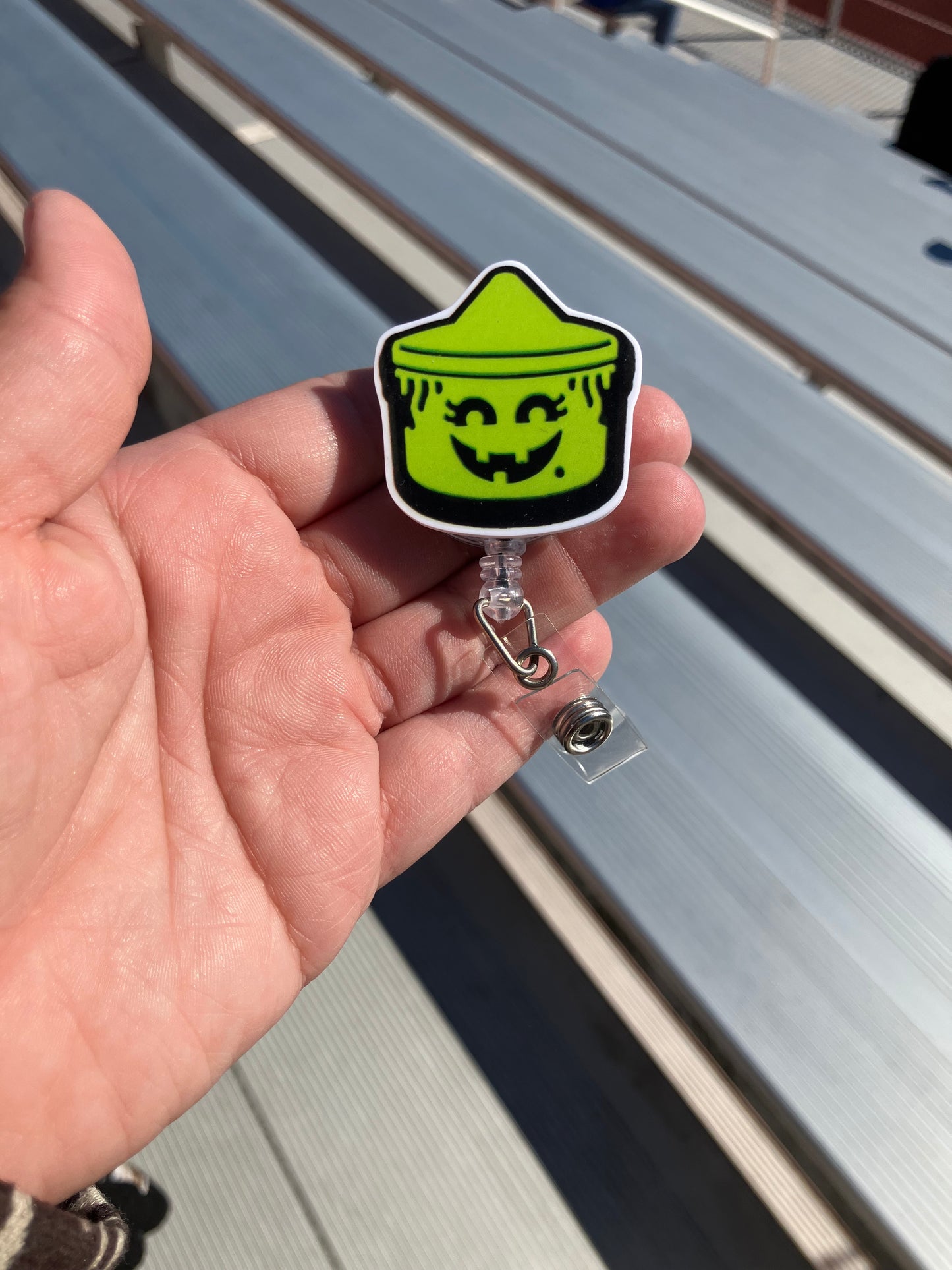 Green boo bucket badge reel