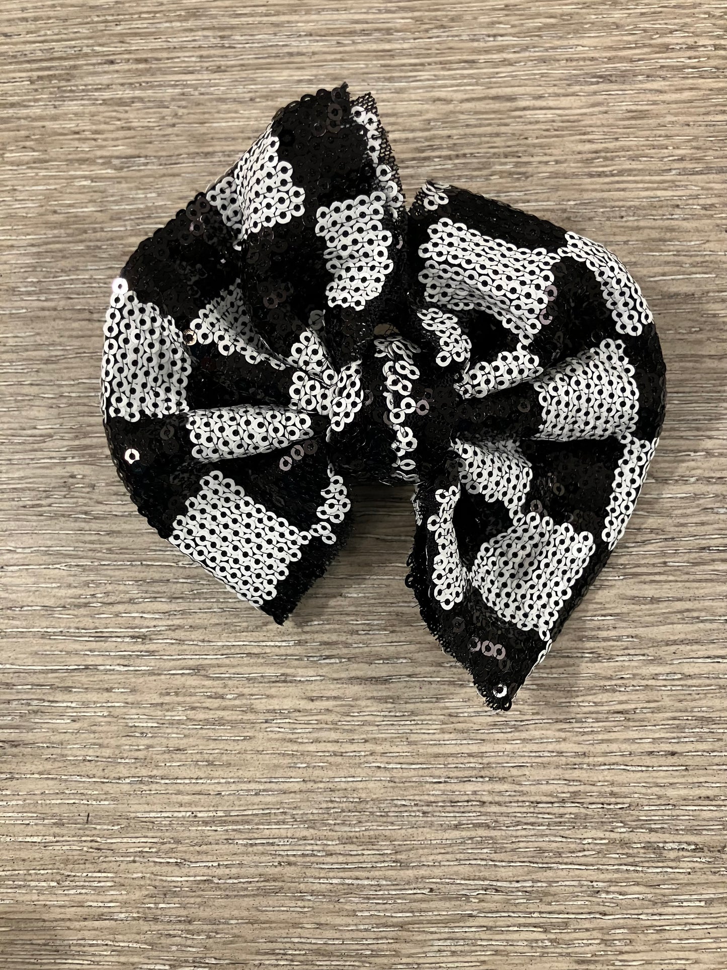 Checkered sequin clip bow
