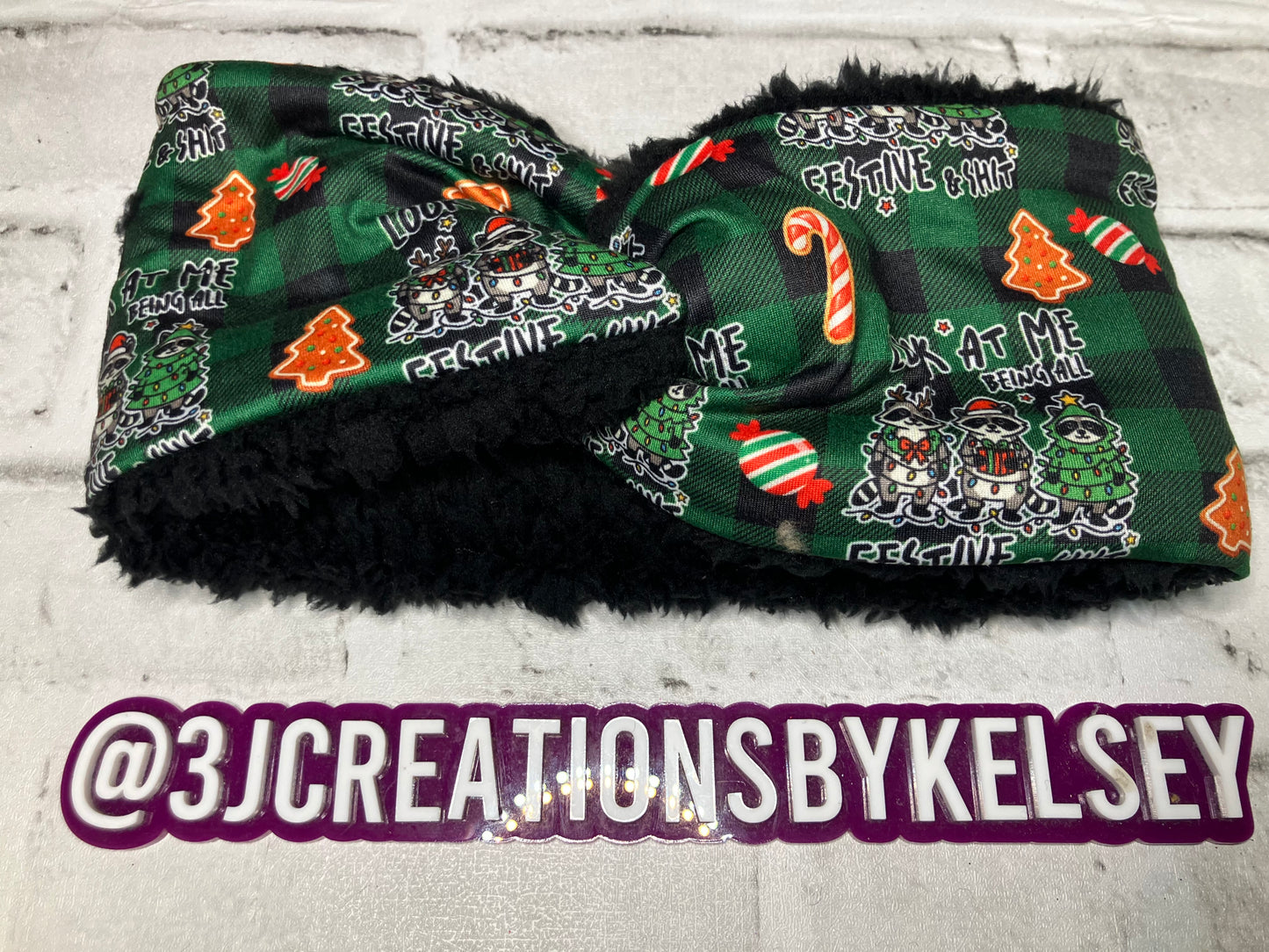 Raccoon all festive and shit child black ear warmers🪩
