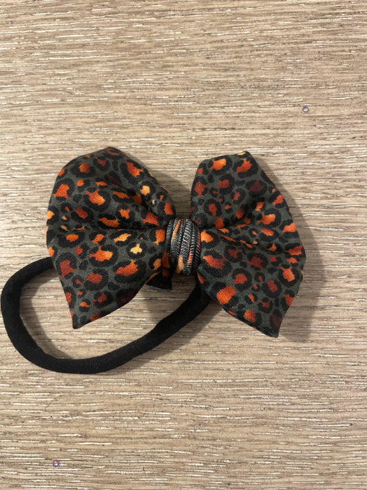 Deep teal gold nylon bow