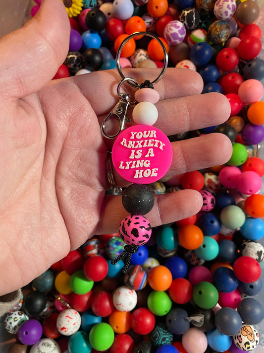 Your anxiety is a lying how hot pink keychain