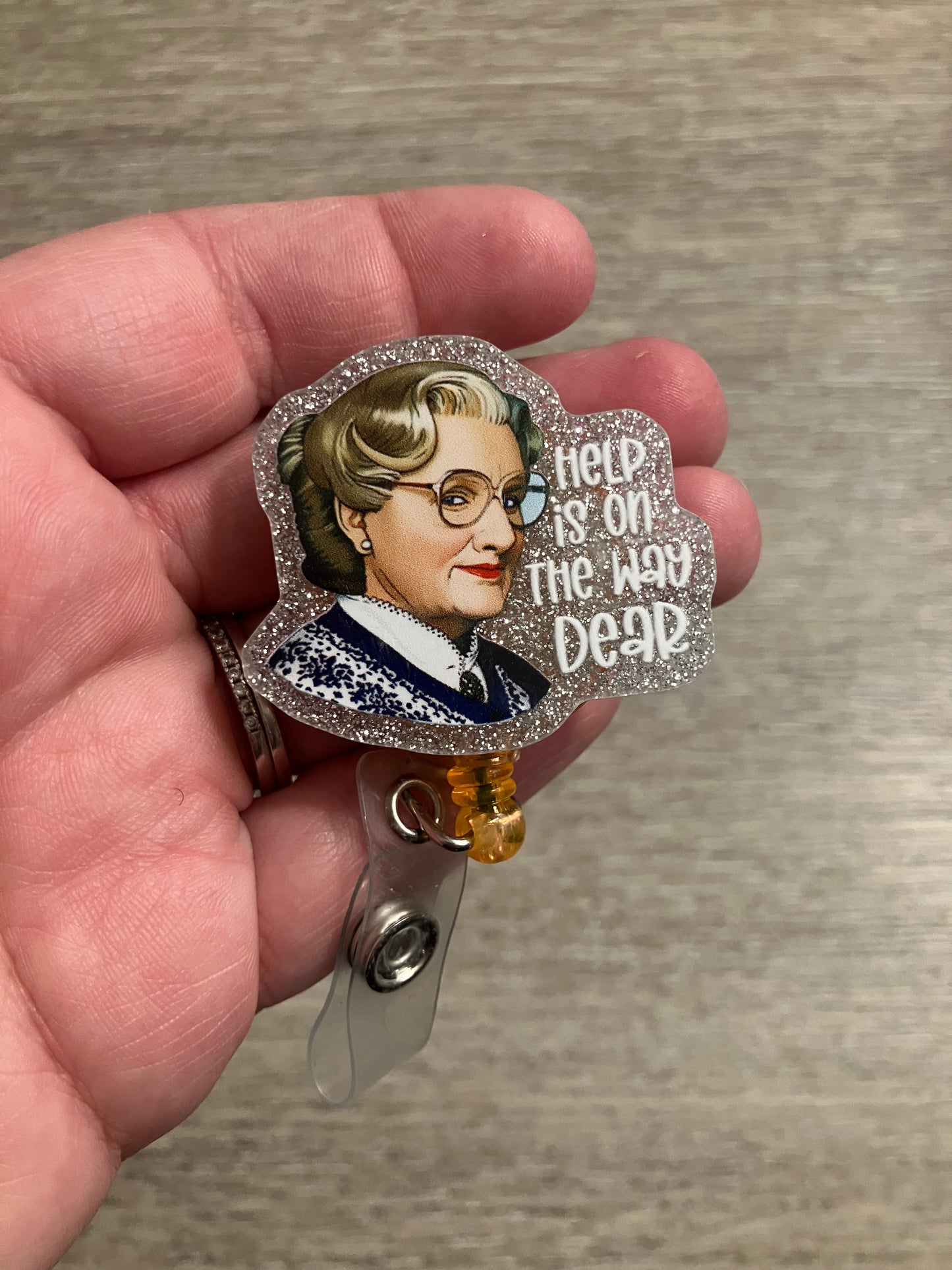 Help is on the at dear badge reel