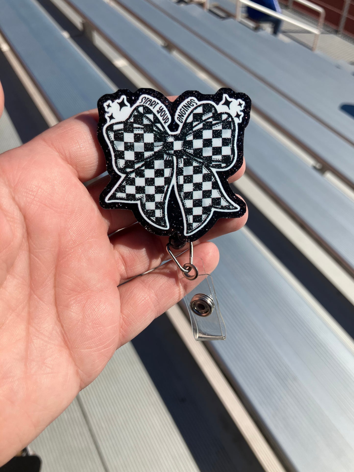 Racing bow badge reel