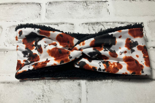 Brown black cow adult ear warmers