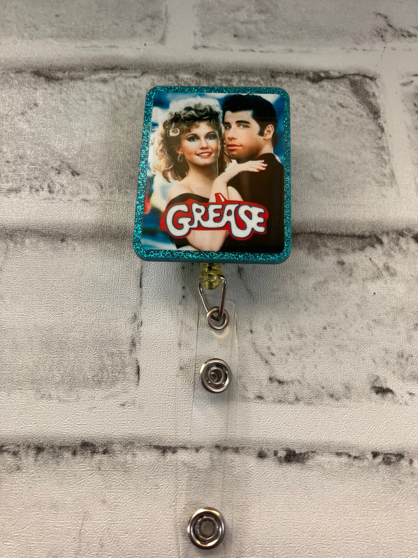 Grease badge reel