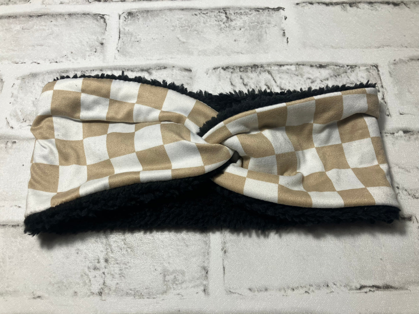Tan checkered child ear warmers