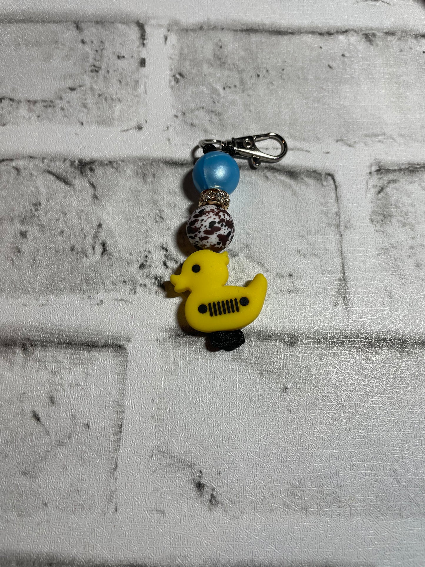 Duck Off road cow print keychain🩵