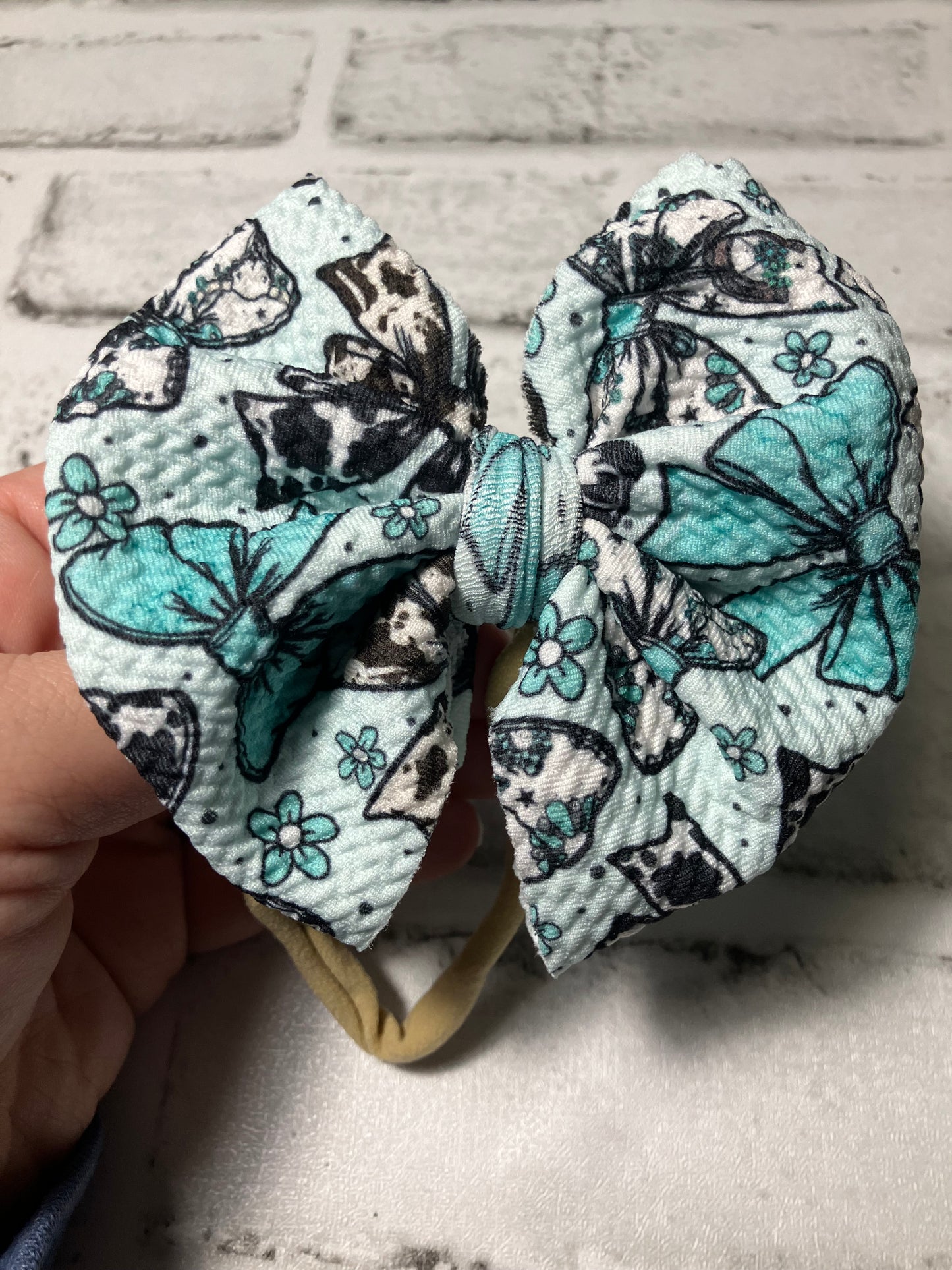 Teal cow bows nylon bow