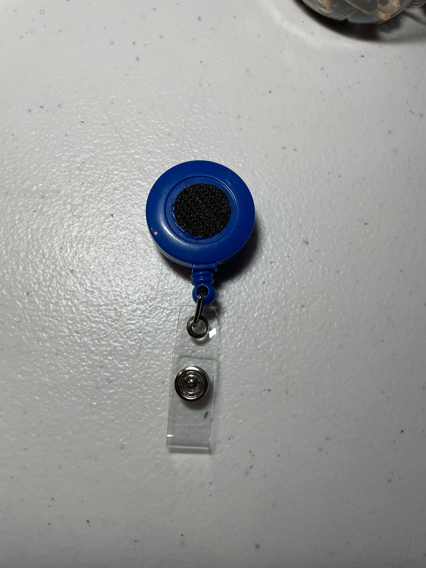 Dark blue badge reel base