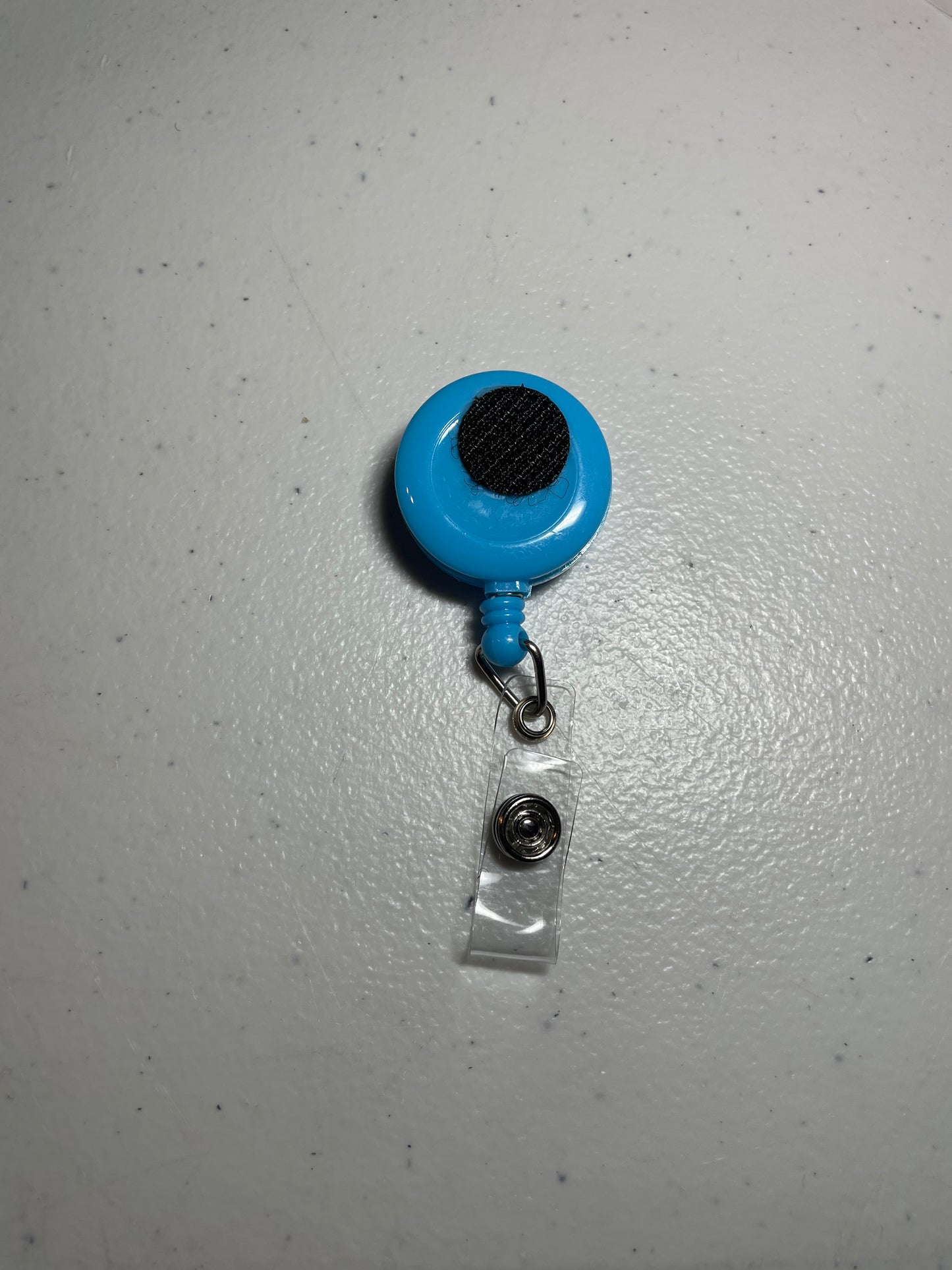 Light blue badge reel base