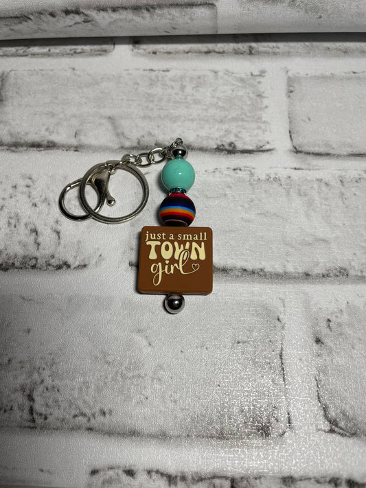 Small town girl serape keychain🩵